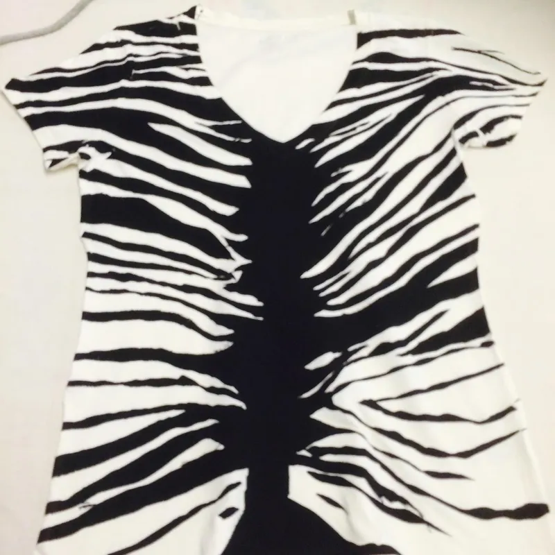 White V-neck T-shirt with a black zebra-stripe design screen printed across the whole garment